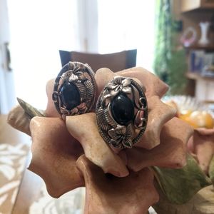 Women's silver tone black stone pierced button earrings